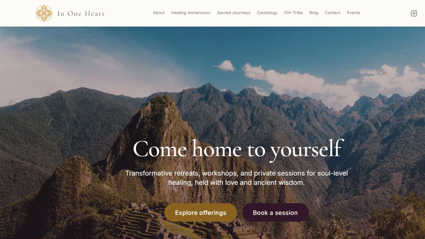 In One Heart homepage with a mountain landscape and links to explore offerings and book a session.